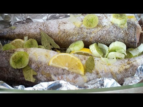 Хек в духовке с морковью и луком