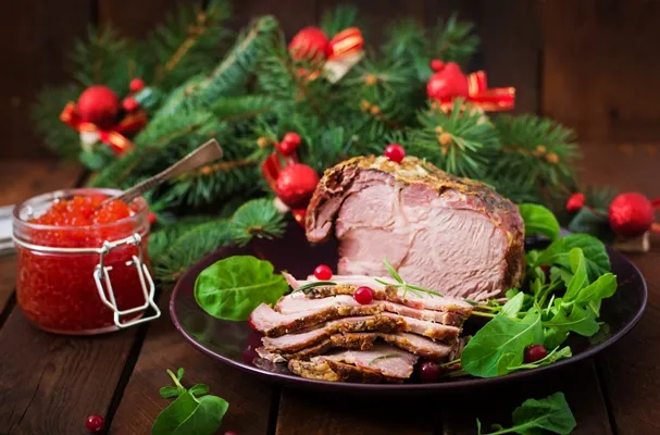 christmas baked ham and red caviar served on the old wooden table - Баранина, запечённая в духовке